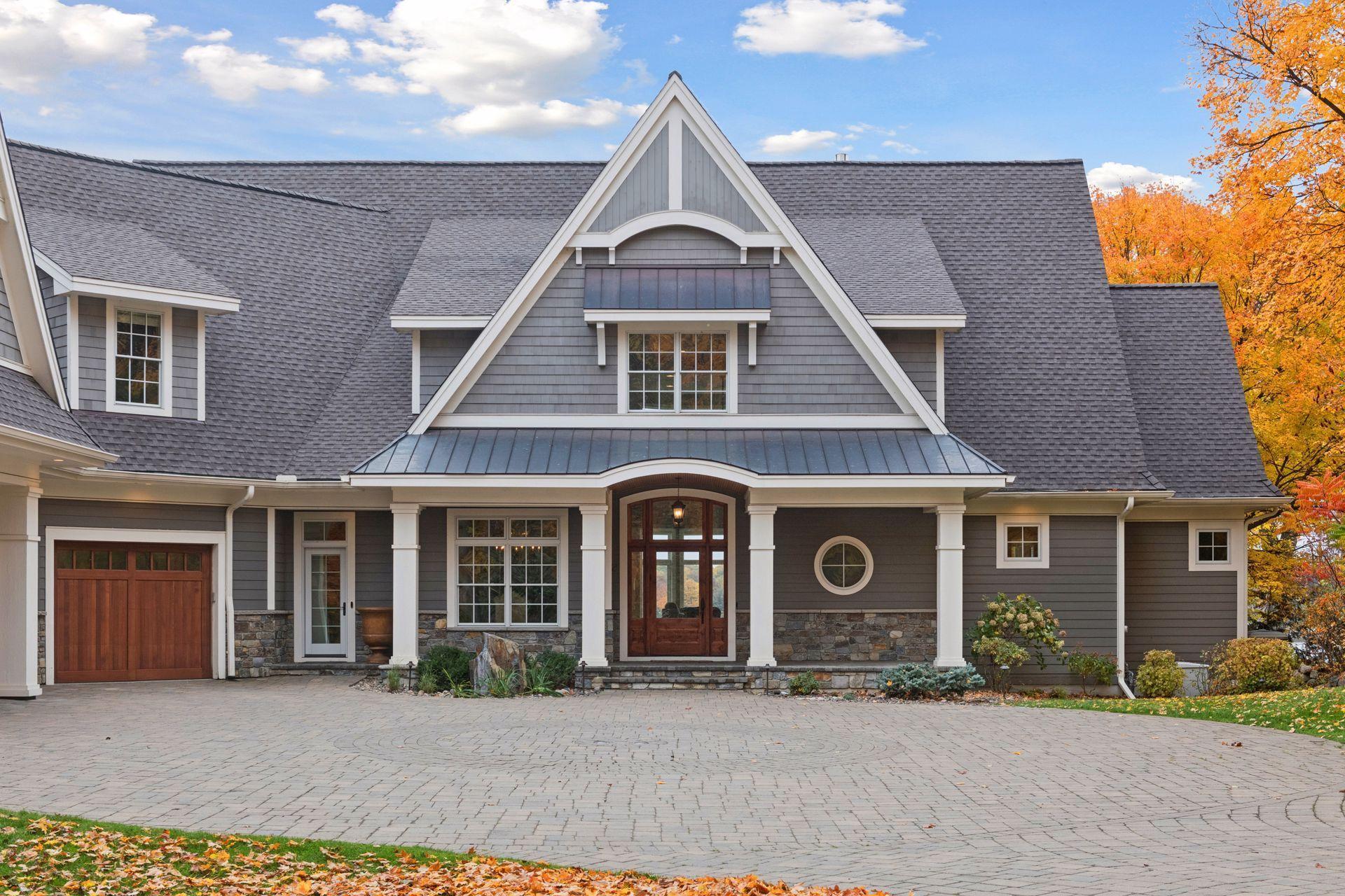 A covered front porch and convenient service door entrance offers a warm & welcoming entryway into the home