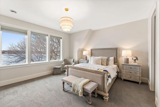 Upper-level suite #2 with ensuite, walk-in closet, and breathtaking lake views