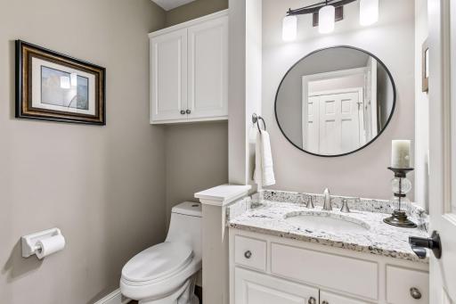 Main floor powder room tucked into back hallway