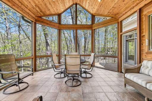 Dramatic screen porch with vaulted ceilings and quiet backyard views
