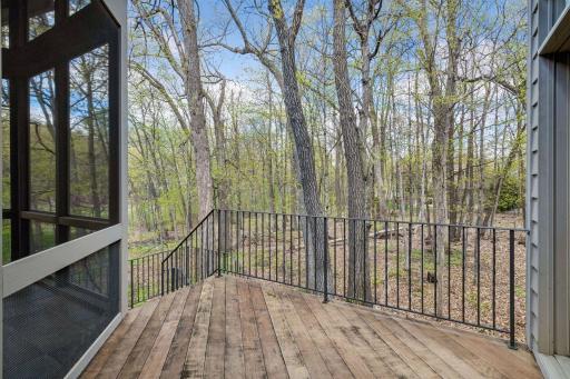Grilling deck off the informal dining & kitchen with access to screen porch and lovely backyard views