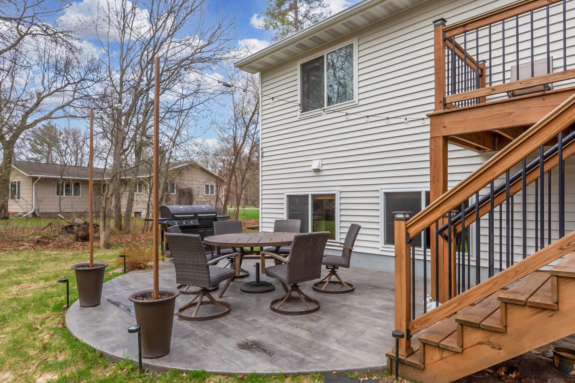 Spacious yard with room to relax or entertain on the stamped concrete patio