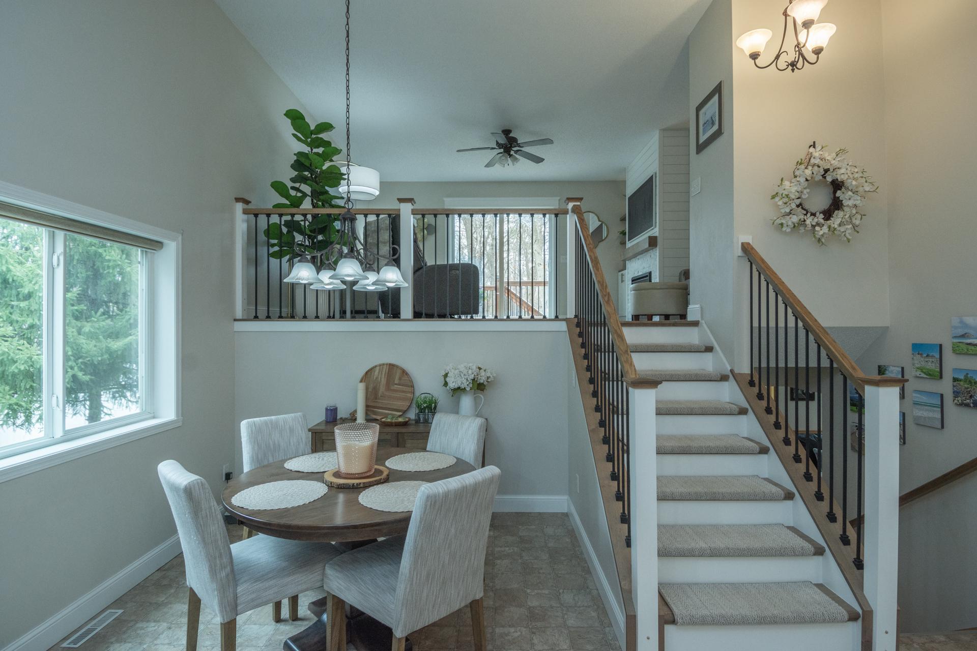An inviting dining space framed by soaring ceilings and elegant sightlines, perfect for both intimate dinners and elevated entertaining