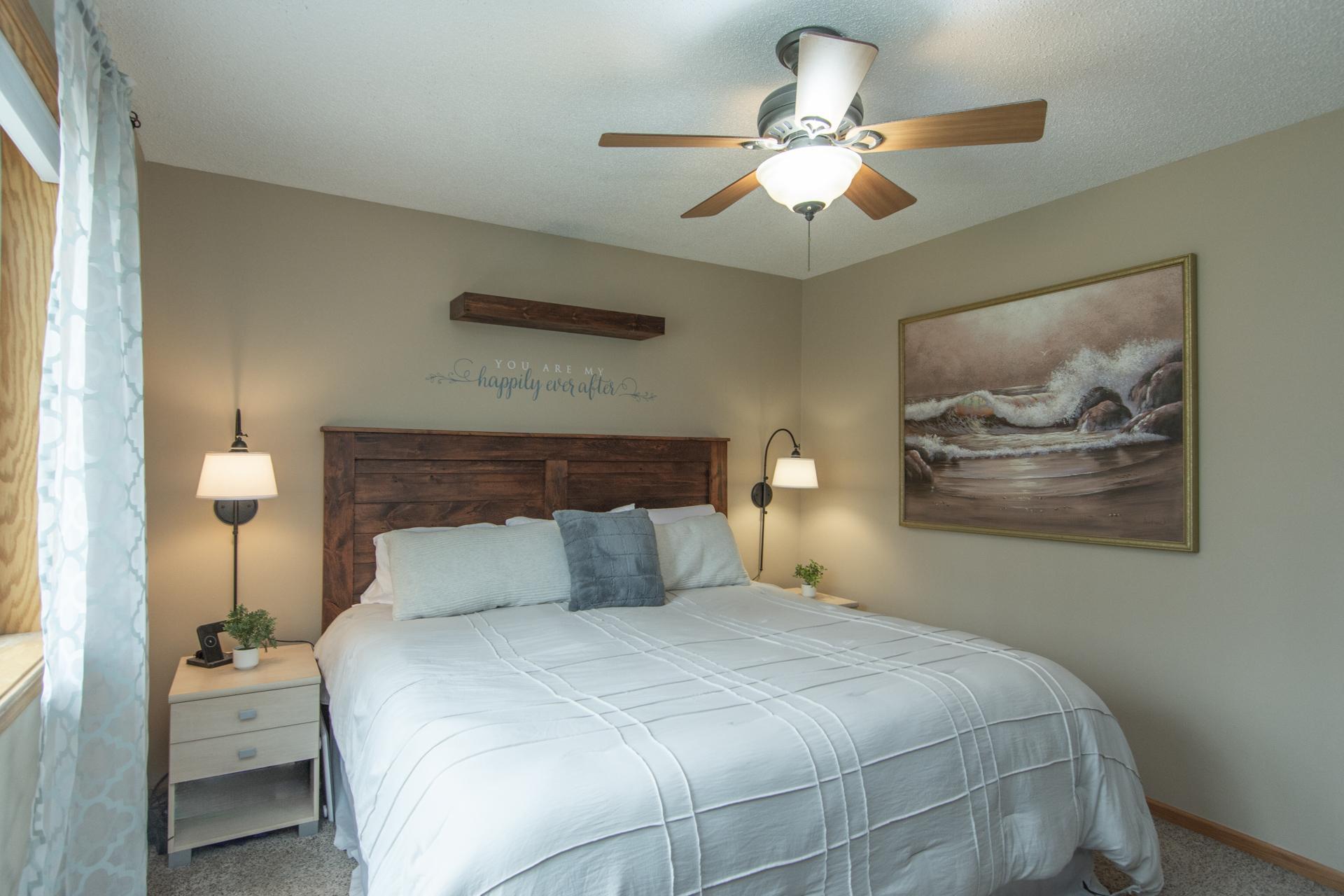 A serene and inviting bedroom retreat featuring warm tones, layered textures, and a refined, calming atmosphere