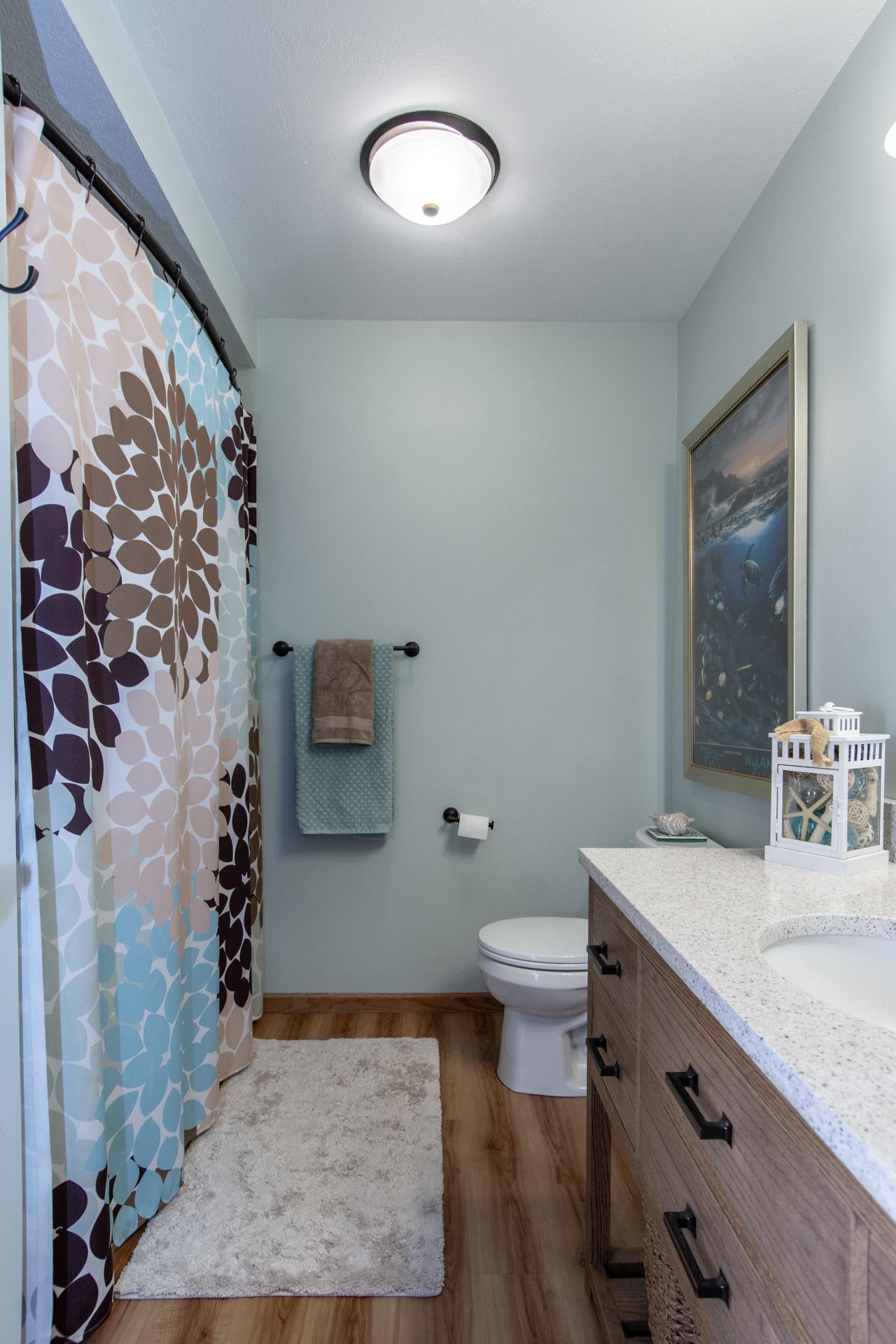 Lower level bath showcasing clean lines, soft tones, and timeless design