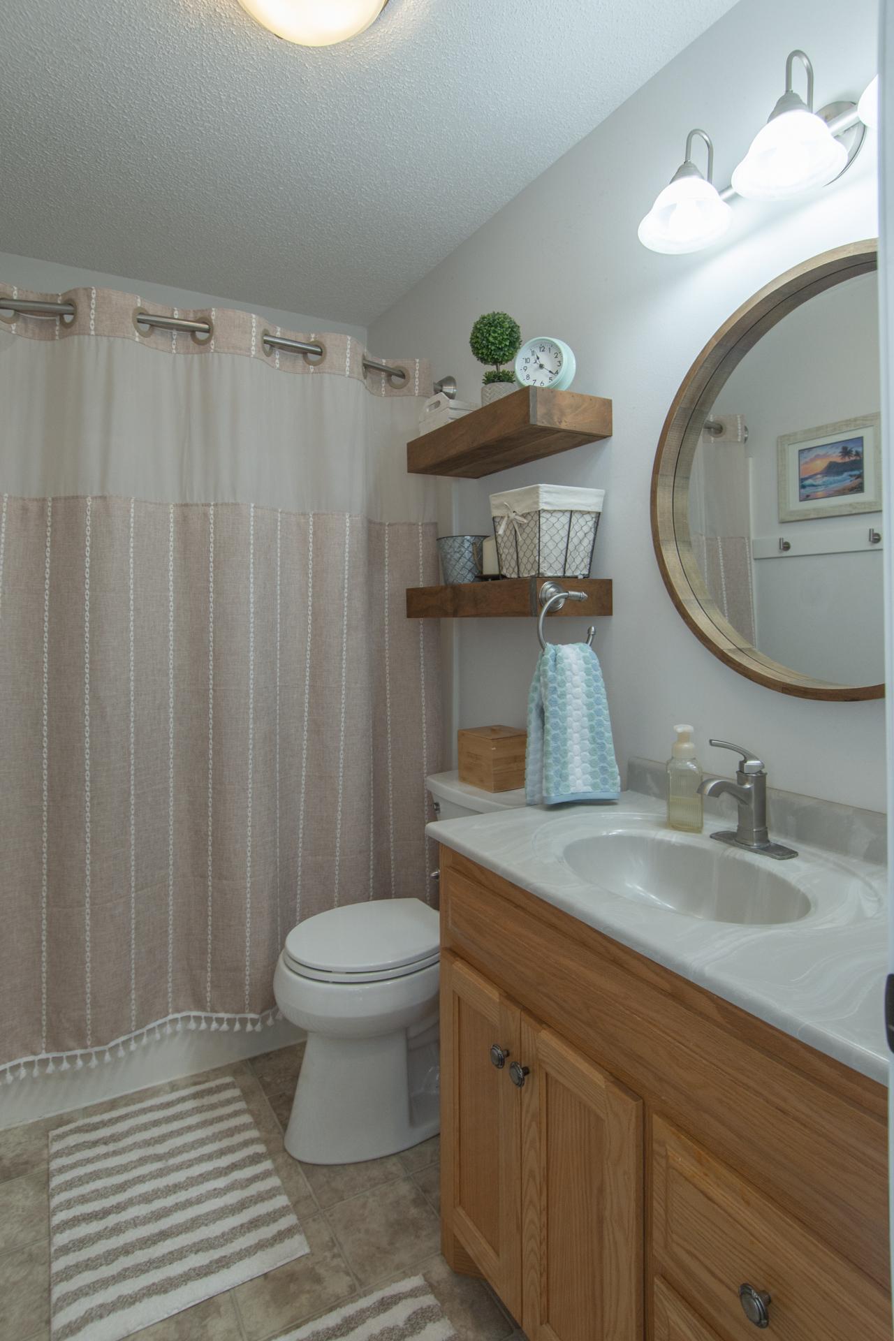 Tastefully updated upper level bathroom with a fresh, polished look