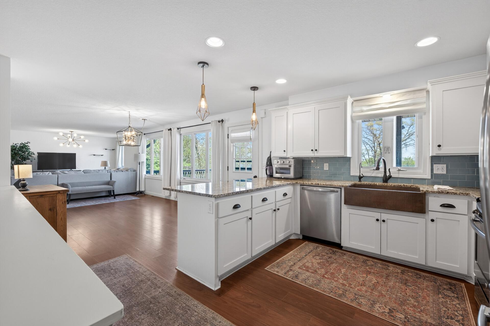 Enjoy your family and friends in this updated kitchen that is open to the dining and living room and has so much storage and counter seating! Plus a HUGE walk-in pantry.!