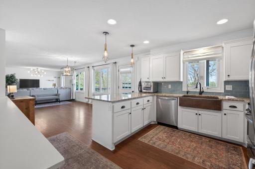 Enjoy your family and friends in this updated kitchen that is open to the dining and living room and has so much storage and counter seating! Plus a HUGE walk-in pantry.!