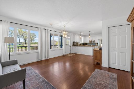Main level view from the living room into the informal dining area and kitchen...check out all the windows featuring beautiful panoramic north facing views.