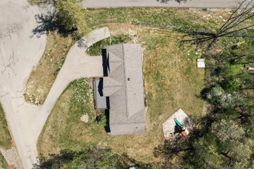 Aerial view directly above the 1 acre property, great view of the asphalt driveway with addition for turnaround or extra parking.