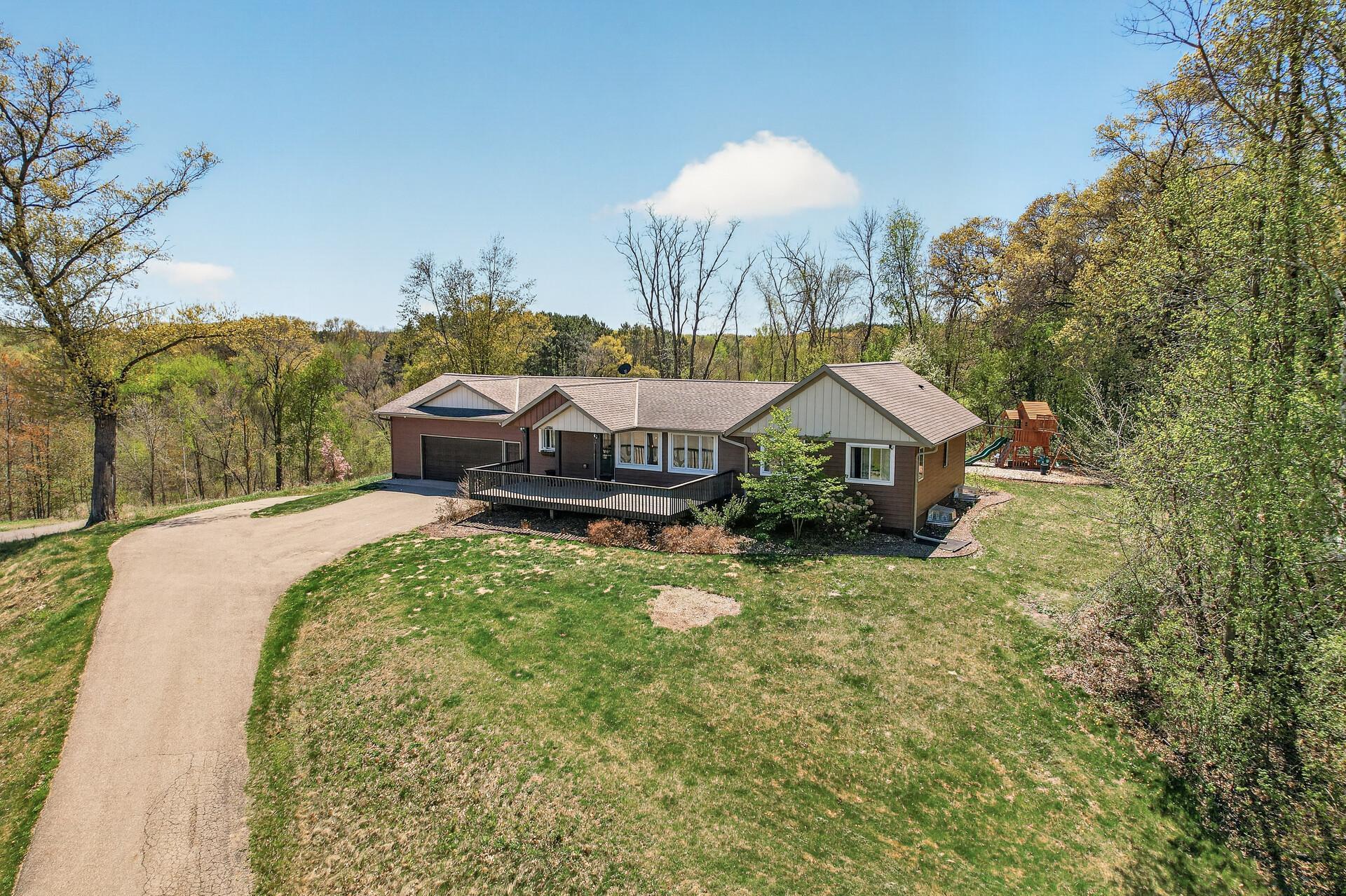 Aerial view of home, rests atop the parcel offering views of the neighborhood and Green Lake most of the year.