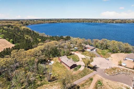 Aerial view of the side rearview of home looking northwest across Green Lake.