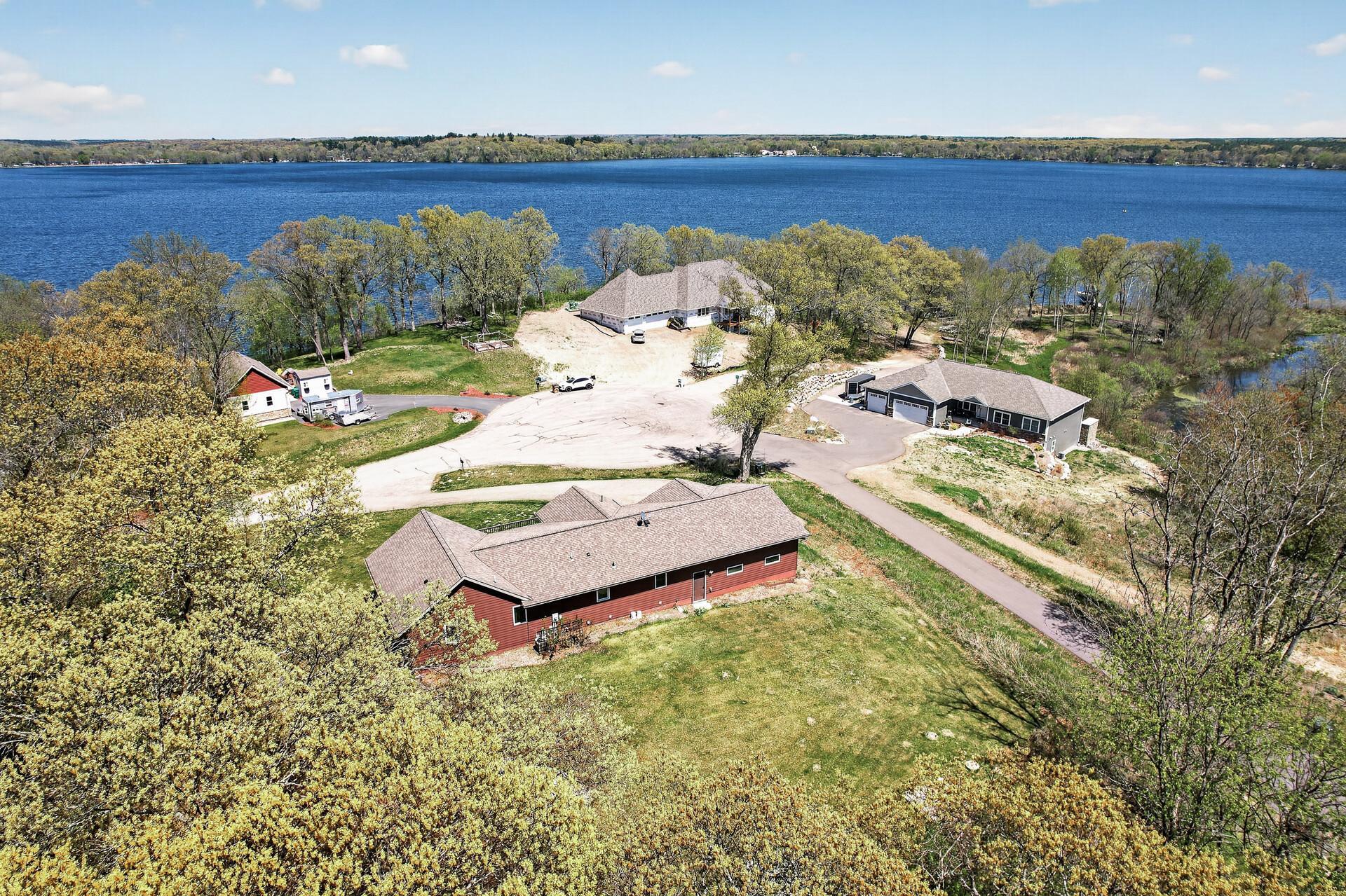 Aerial view of rear of home looking north across the full culdesac towards Green Lake.