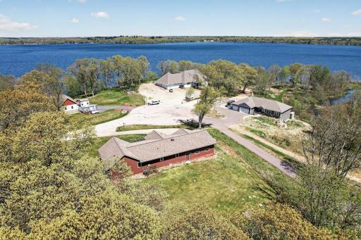 Aerial view of rear of home looking north across the full culdesac towards Green Lake.