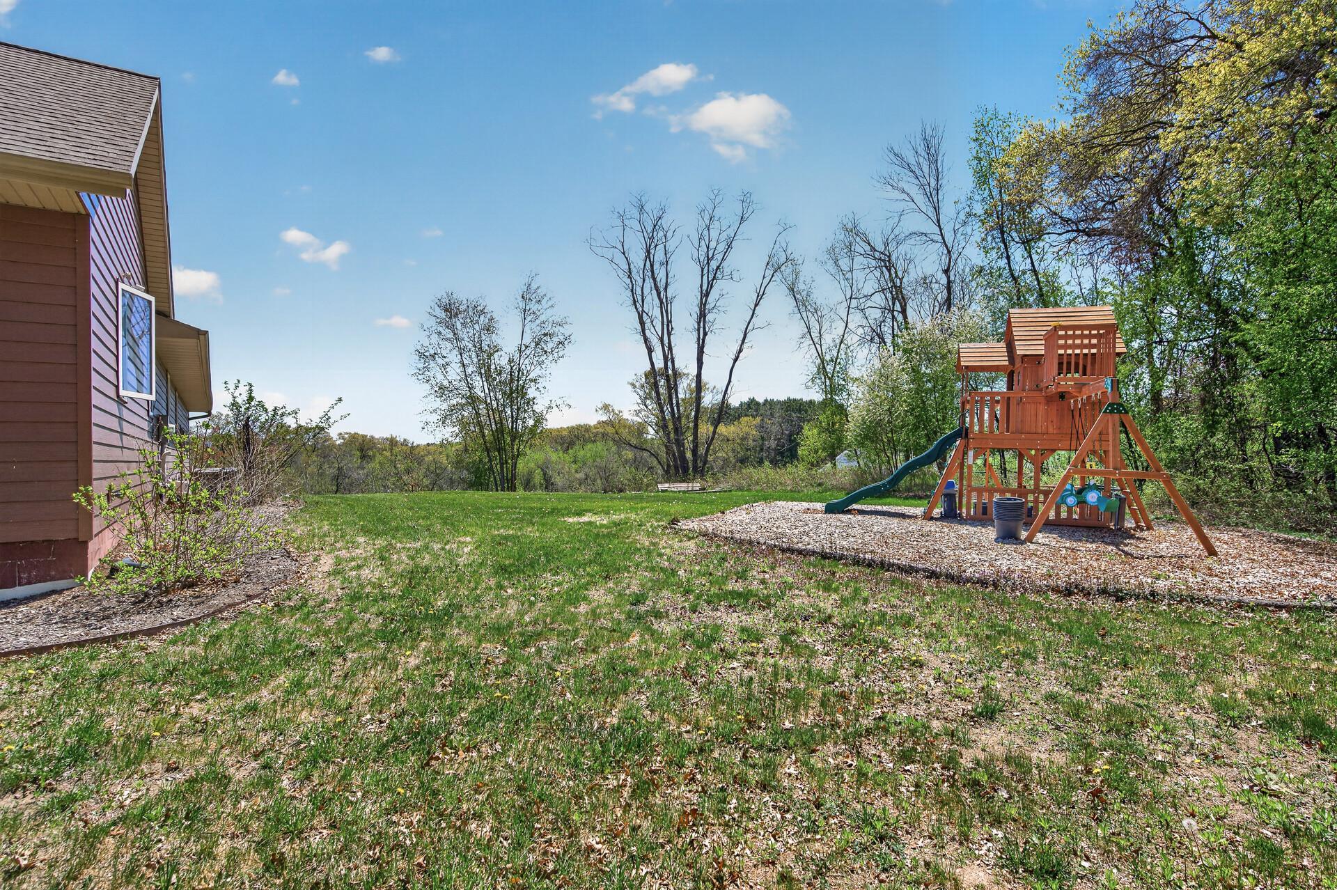 Backyard view, playset included