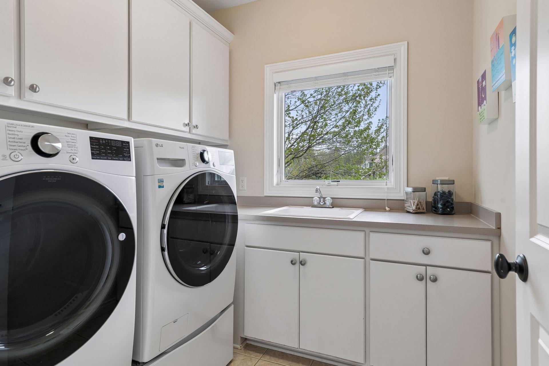 Bright laundry room with generous storage