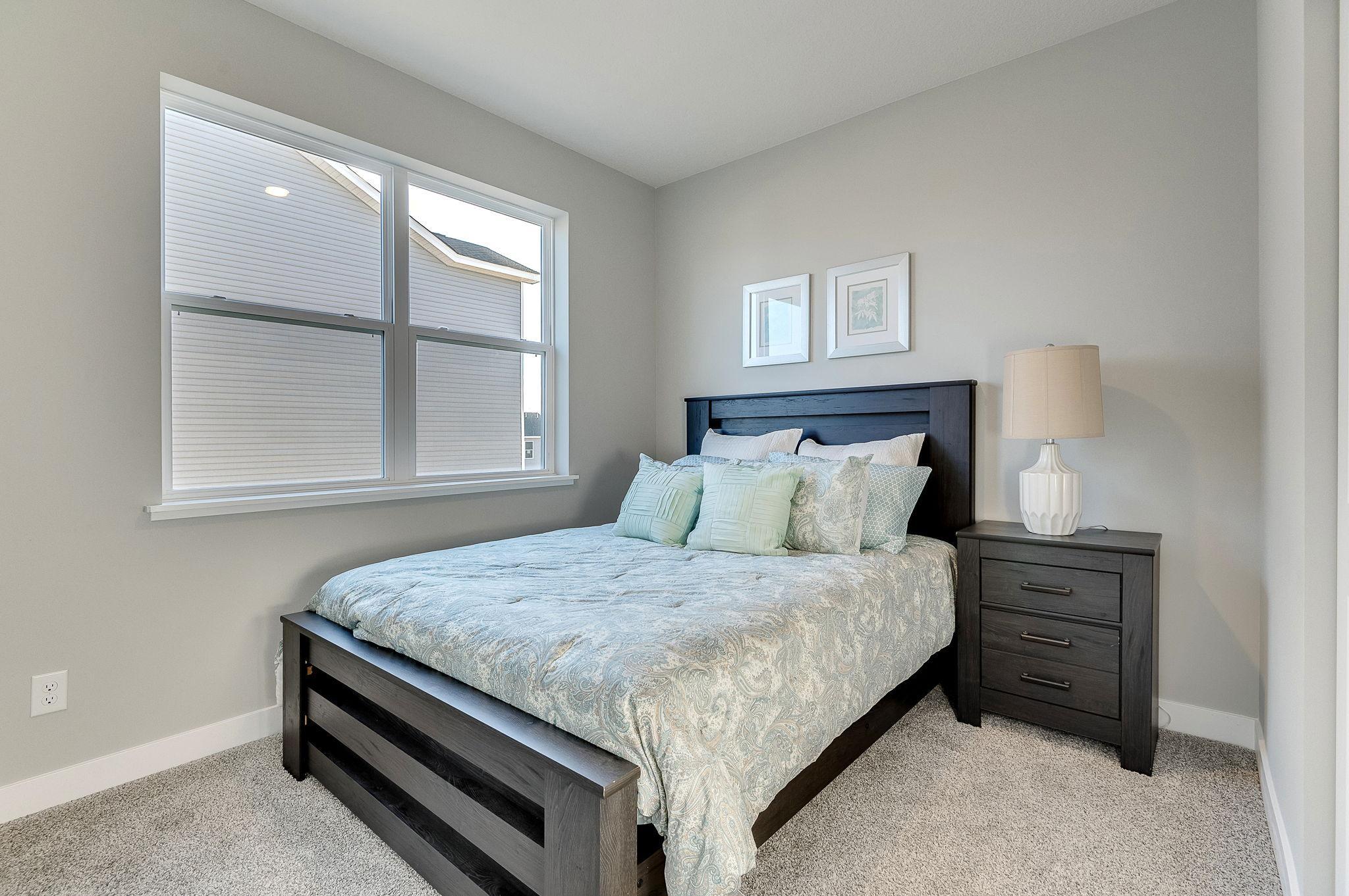 Third bedroom of three total. Model home, finishes will vary.