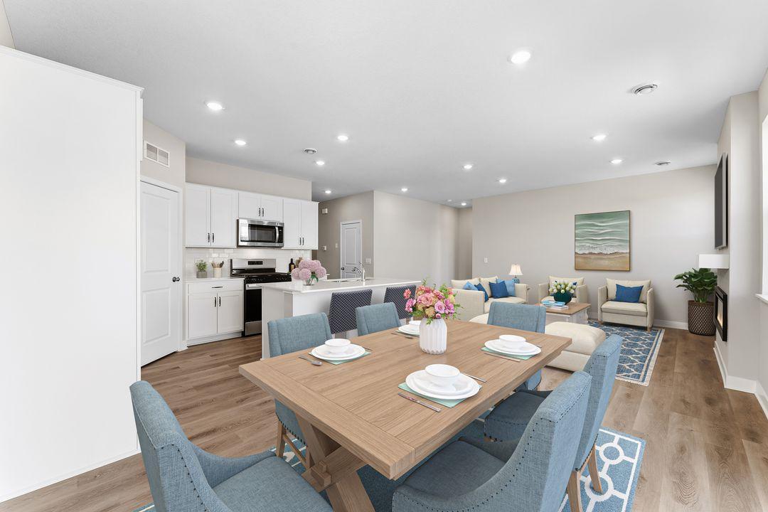Beautiful open concept floor plan with luxury vinyl plank flooring, white cabinets, stainless steel appliances and white subway tile backsplash! This home is just waiting for your finishing touches!