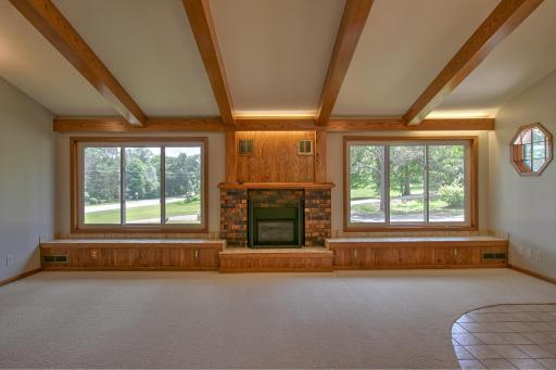 Enjoy plenty of sunshine in the living room & the ambiance of the fireplace!