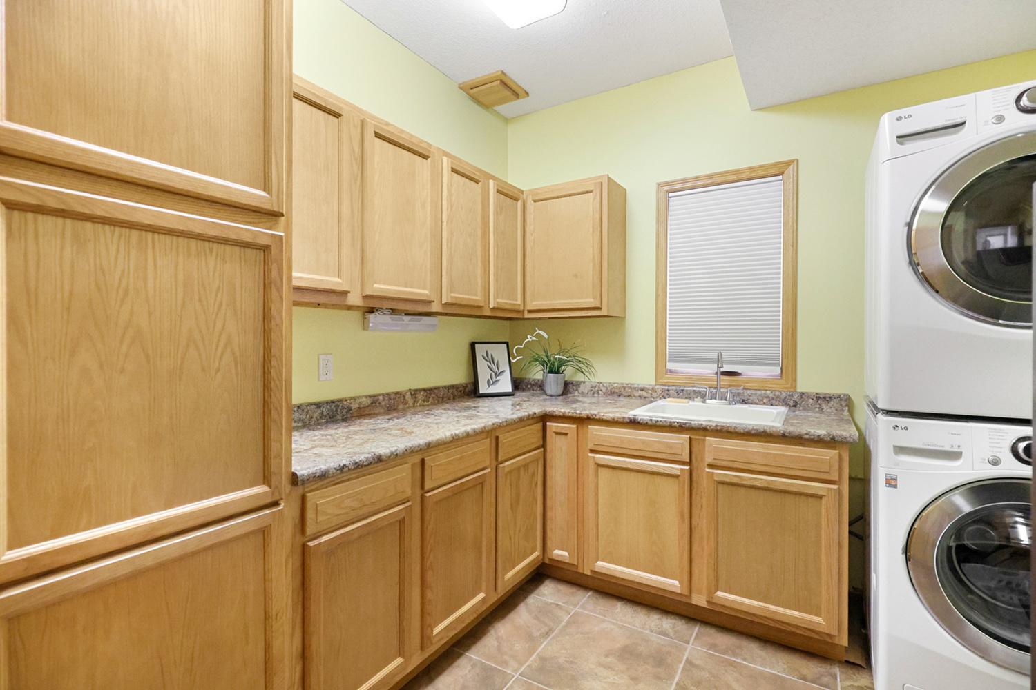 Large laundry room with plenty of storage