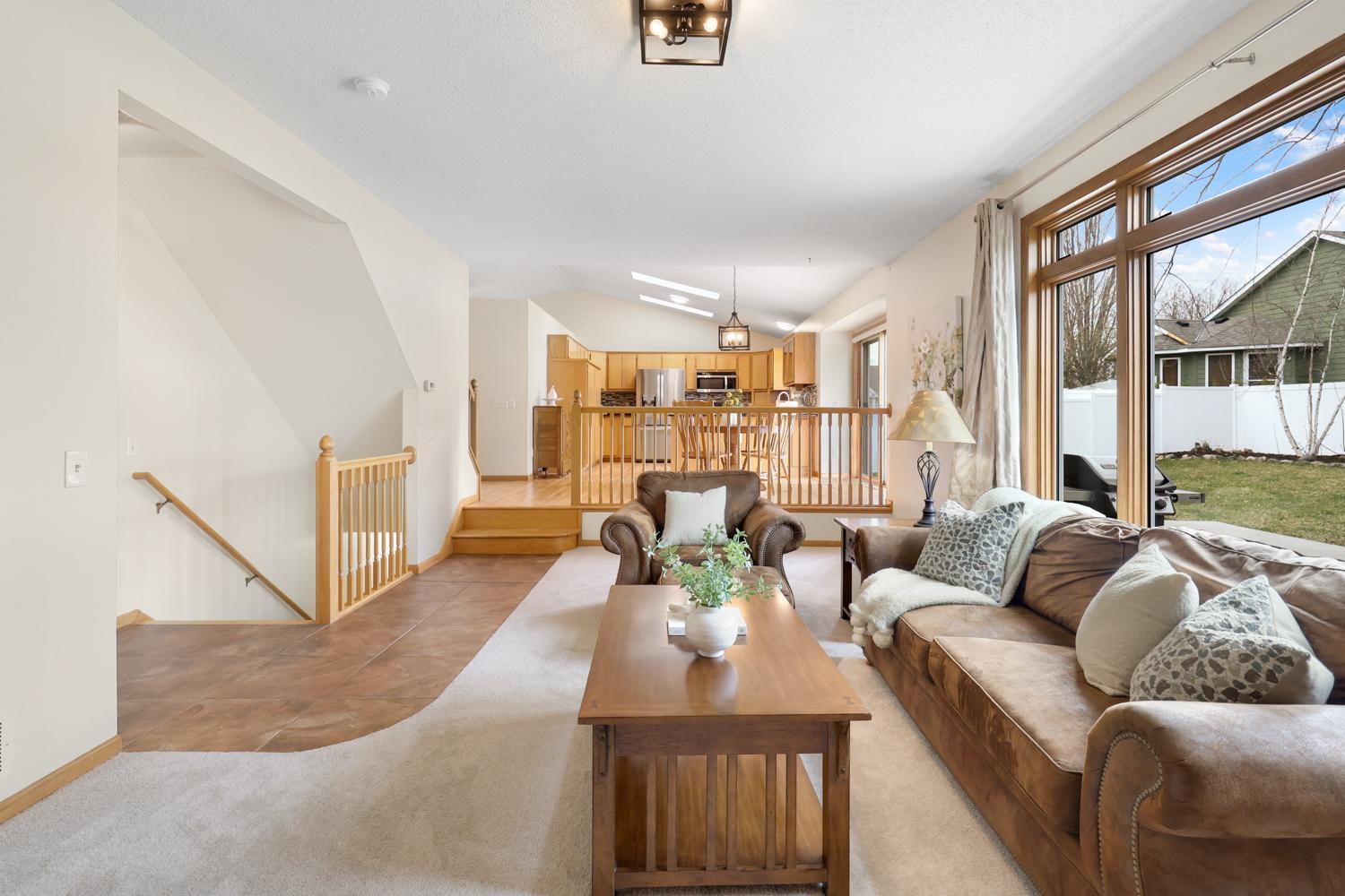 Living room opens up to the dining room and kitchen