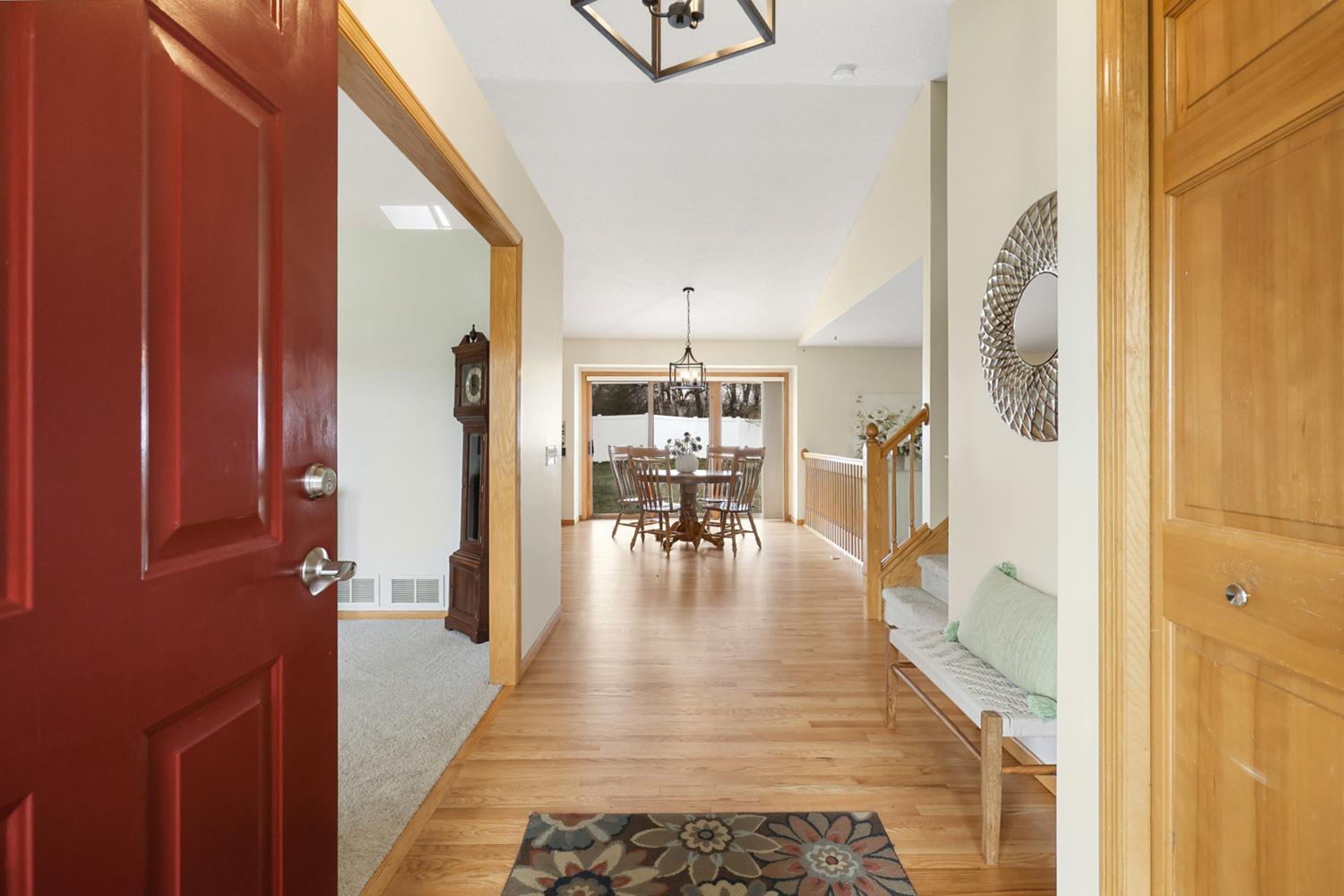 Large entry way highlighting the freshly refinished hardwood floors