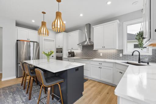 Abundant kitchen cabinetry, counterspace and pantry