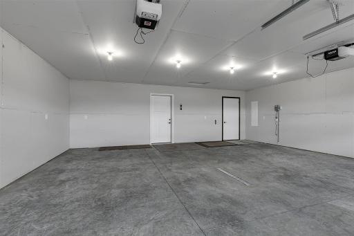 Oversized 2 car garage with floor drain and hot/cold water spigot
