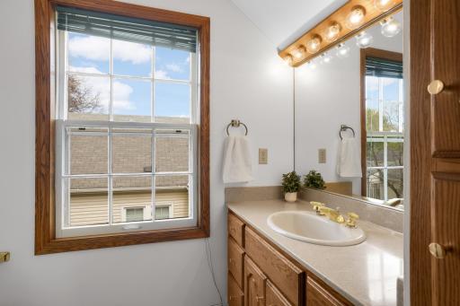 The primary 3/4 bathroom has fantastic lighting, making it the perfect spot to get ready in the morning.