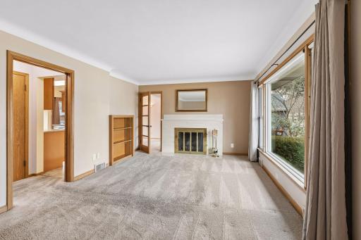 Step into the living room. Note the built in shelves.