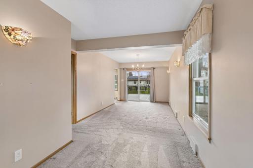 Through the living room is the dining room and den space. These room are super versatile.