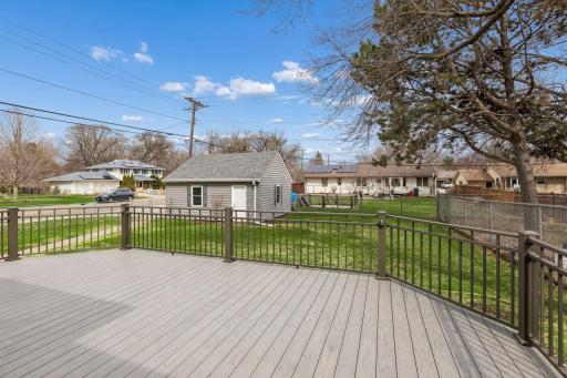 The newer patio door here leads out to your composite, party sized deck!