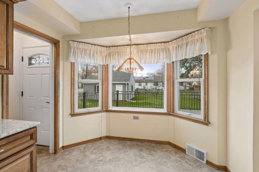 The kitchen also has this bright and cheery eat in area overlooking the backyard.