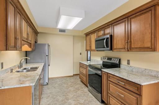 Another view of the kitchen showing off the generous cabinet and counter space.