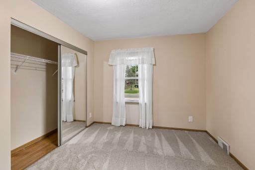 Underneath the carpeting on the main floor is hardwood flooring; visible in the closets.