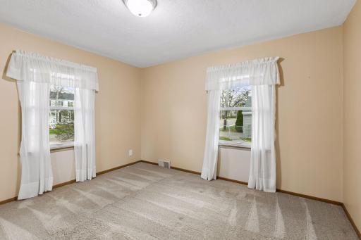The second bedroom also has two windows and overlooks the backyard.