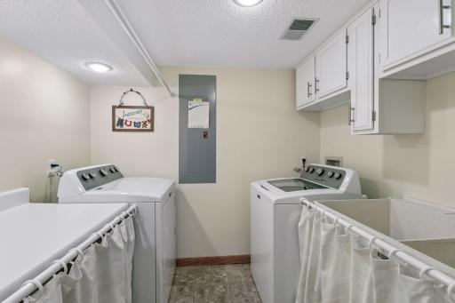 The door leads into this clean laundry room.