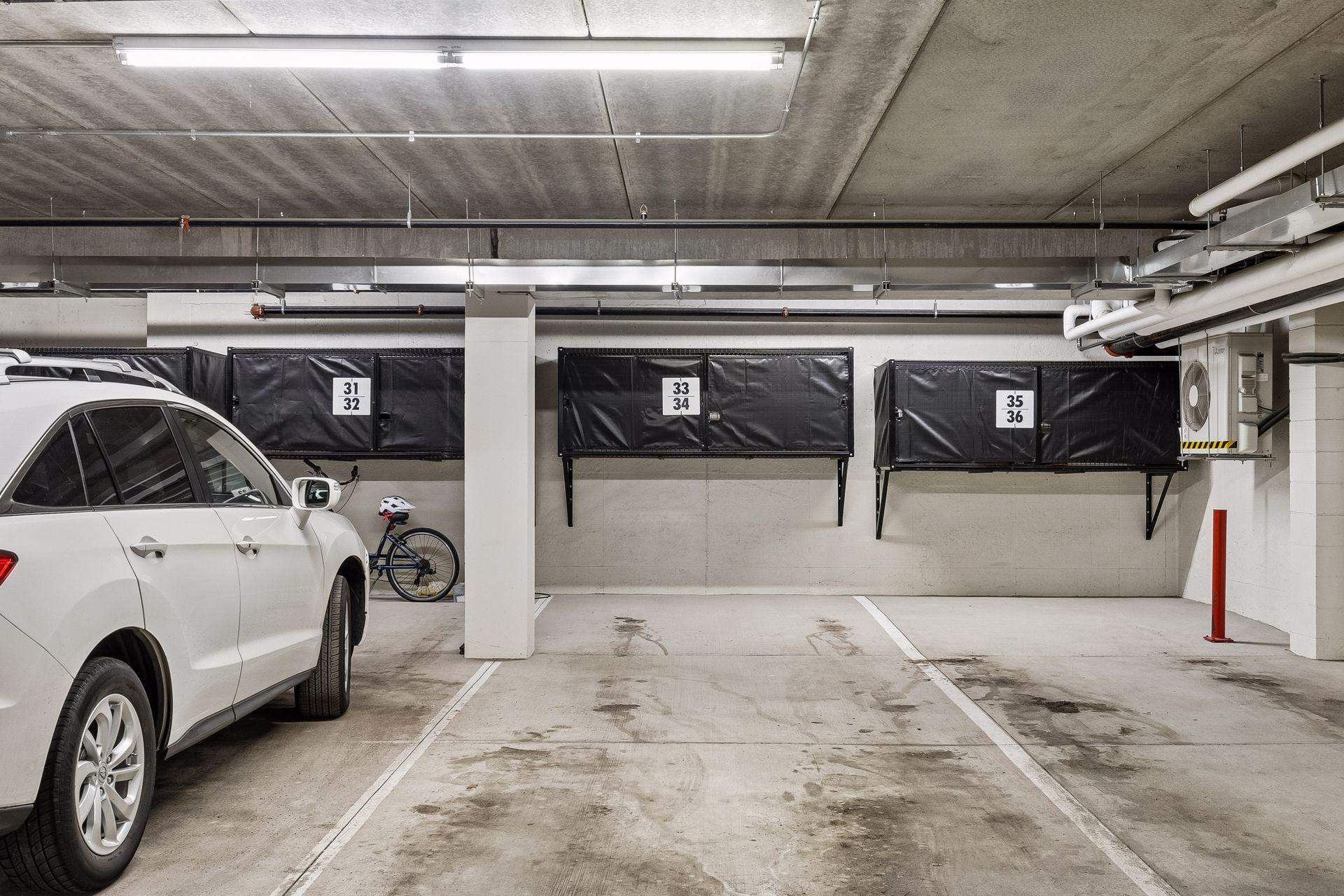Tandem underground heated parking spaces #33 & #34 with additional private storage conveniently located behind the stalls.
