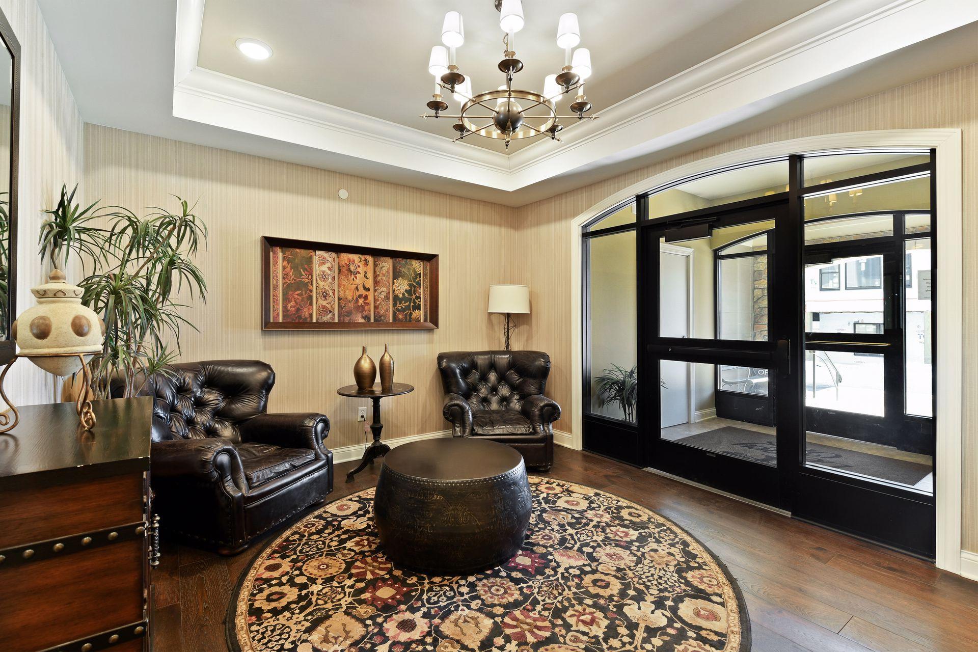 Welcoming front entry area with secure building access.
