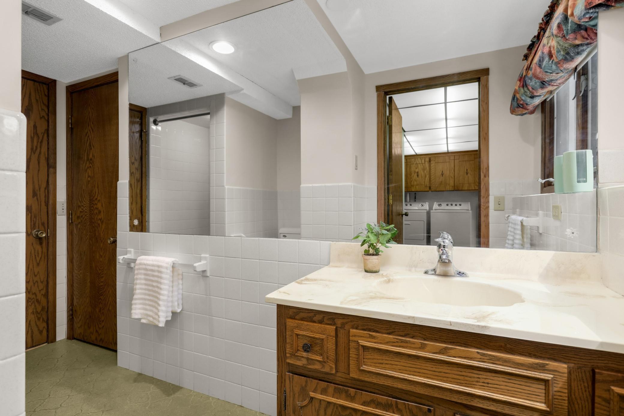 Lower level bathroom with shower.