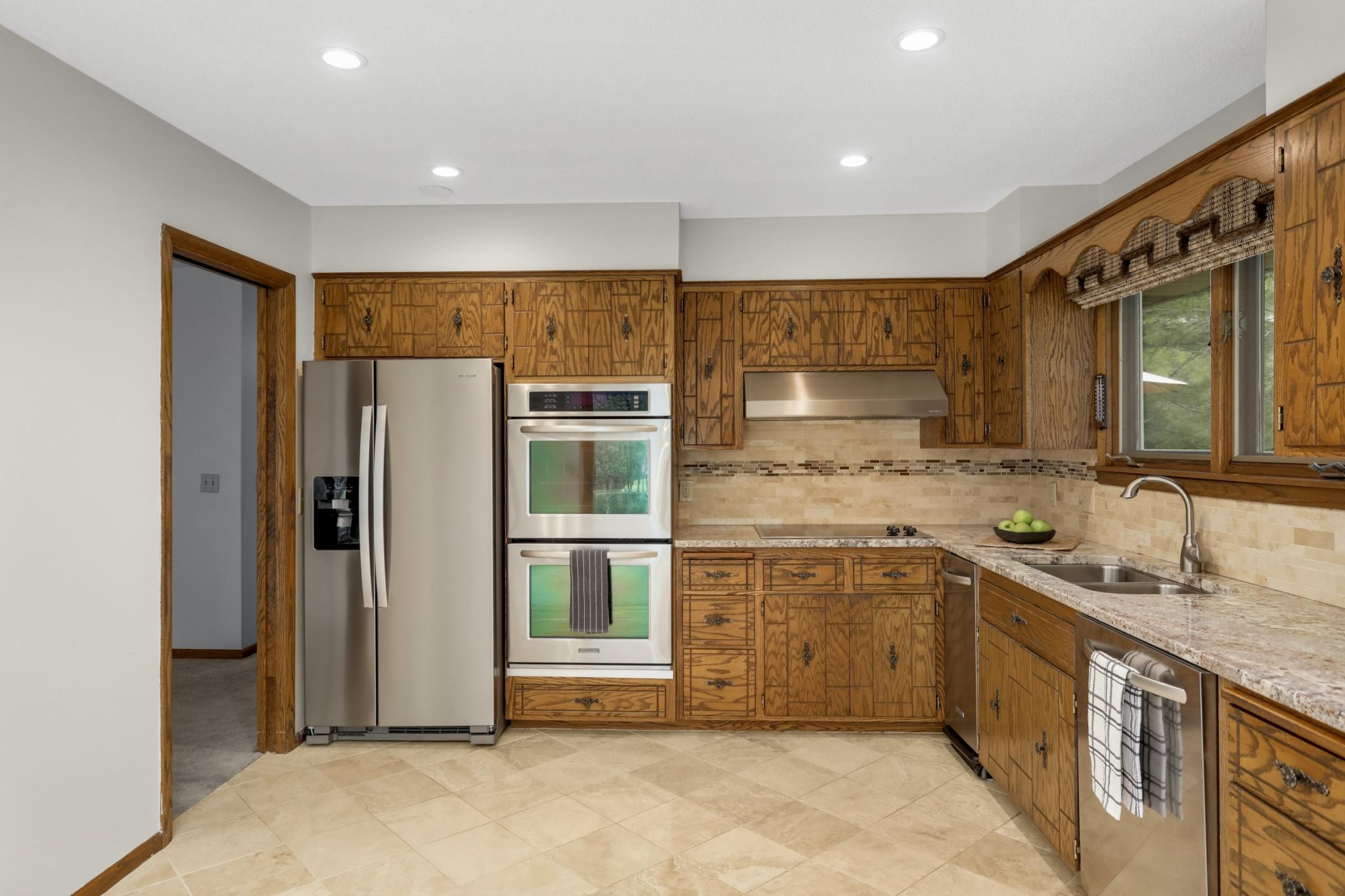 Open eat- in kitchen to formal dining room. Deep double sink.