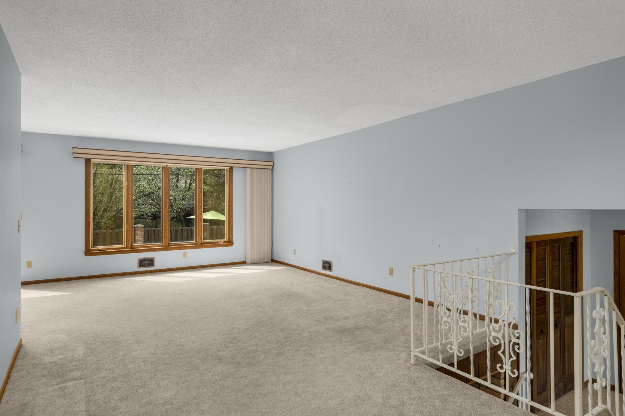 Large formal living that has great views of the pool.