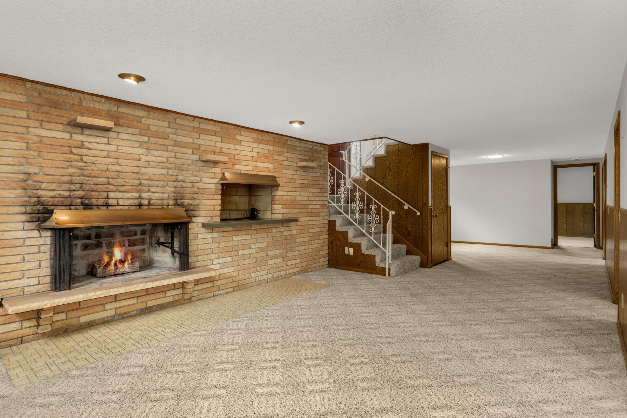 Full wall brick wood burning fireplace with grill. Newer fireplace liner & Chimney weather proofing.