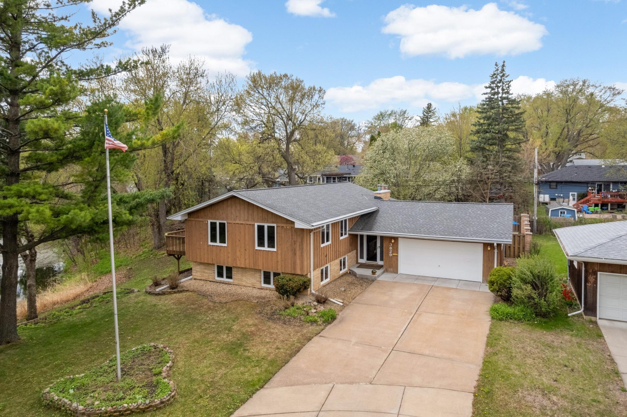 Located at the end of the cul-de-sac. Concrete driveway. Newer concrete front step and apron around garage. Over sized 2 car heated garage with workshop! Work Shop includes workbench, cabinet, floor drain and sink! Newer gutters with gutter helmets!