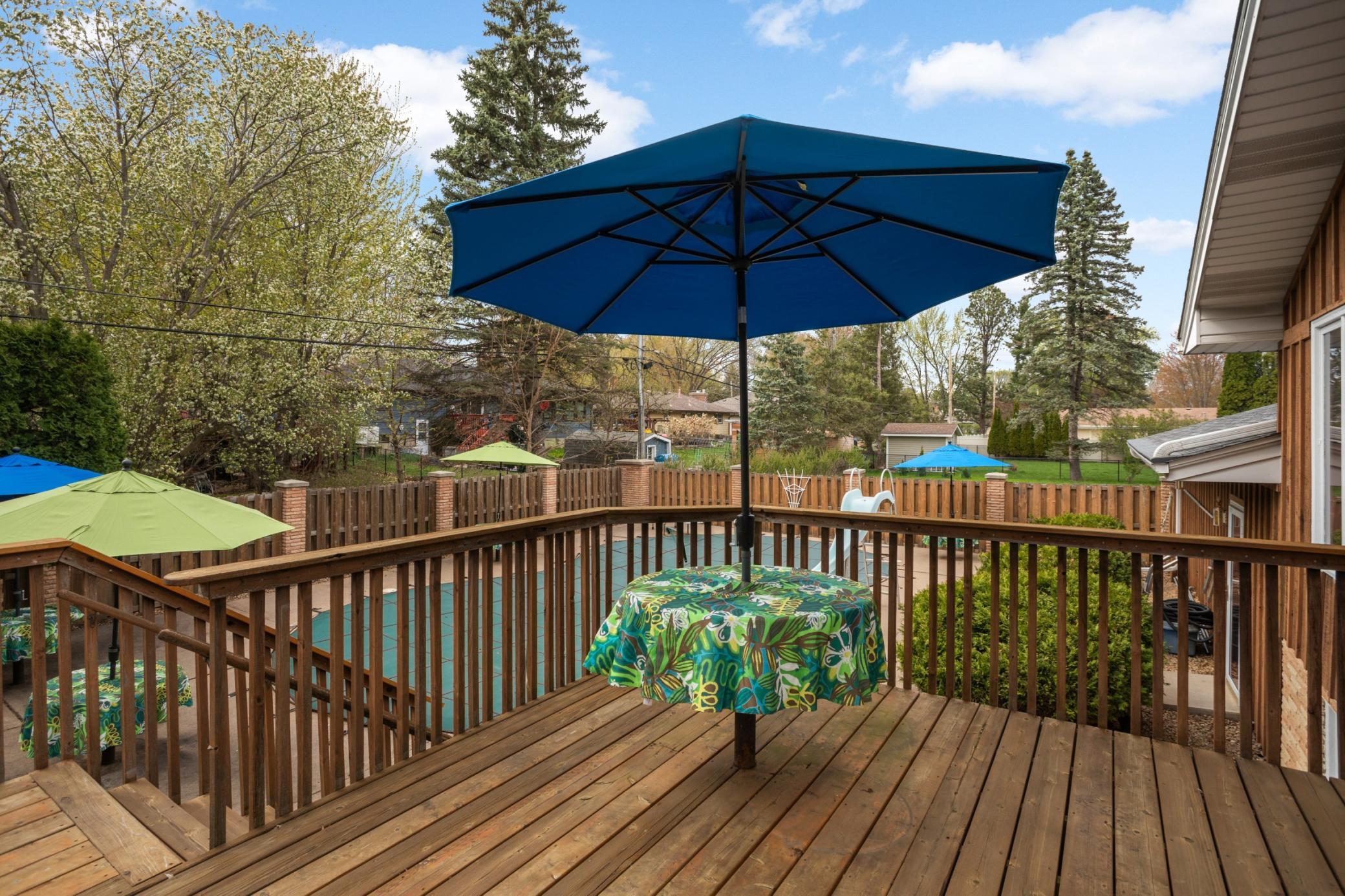 Let the pool party begin! Enjoy grilling on gas grill. This deck looks over pool & pond.