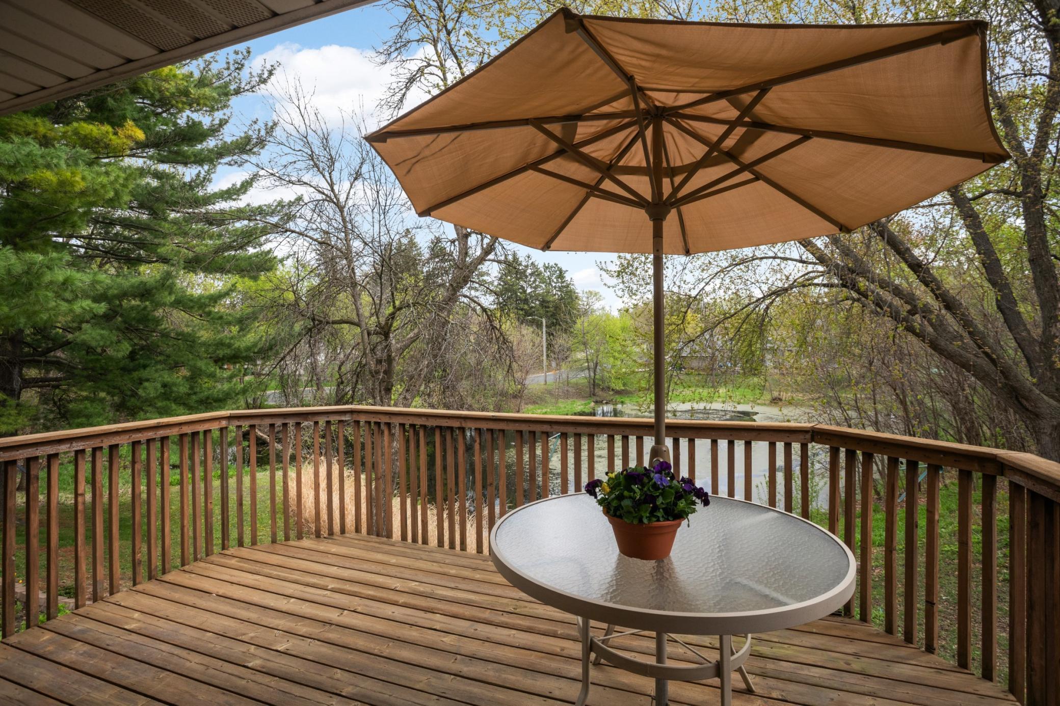The views out the primary bedroom are spectacular! Large deck overlooking pond. Built in table on deck.