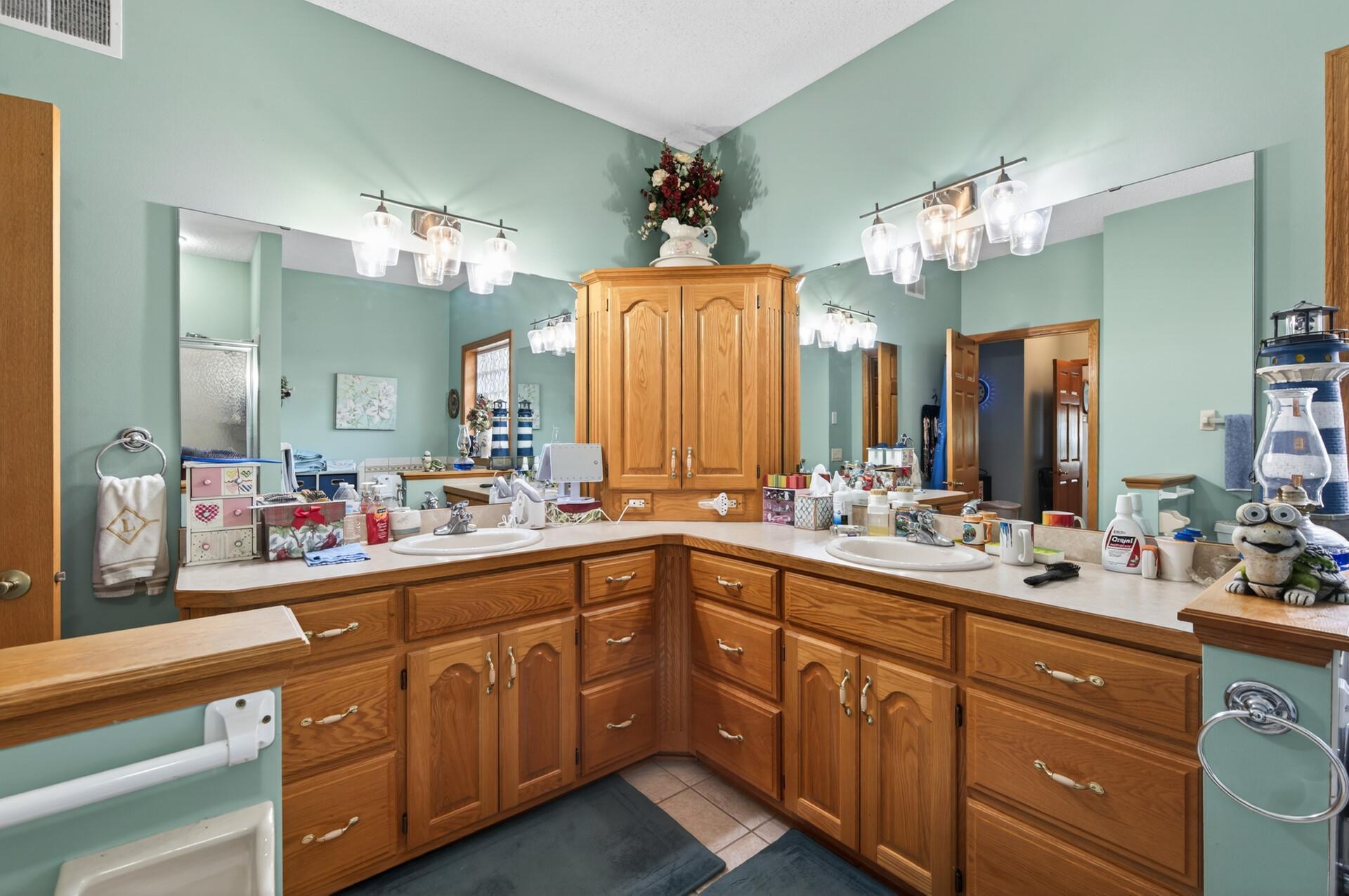 You won't lack in storage in this primary bath!