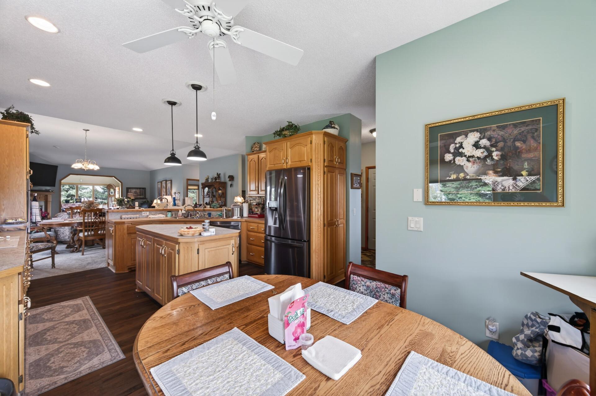 Open layout with the dining area, kitchen, living room, and 4-season porch all seamlessly connected.