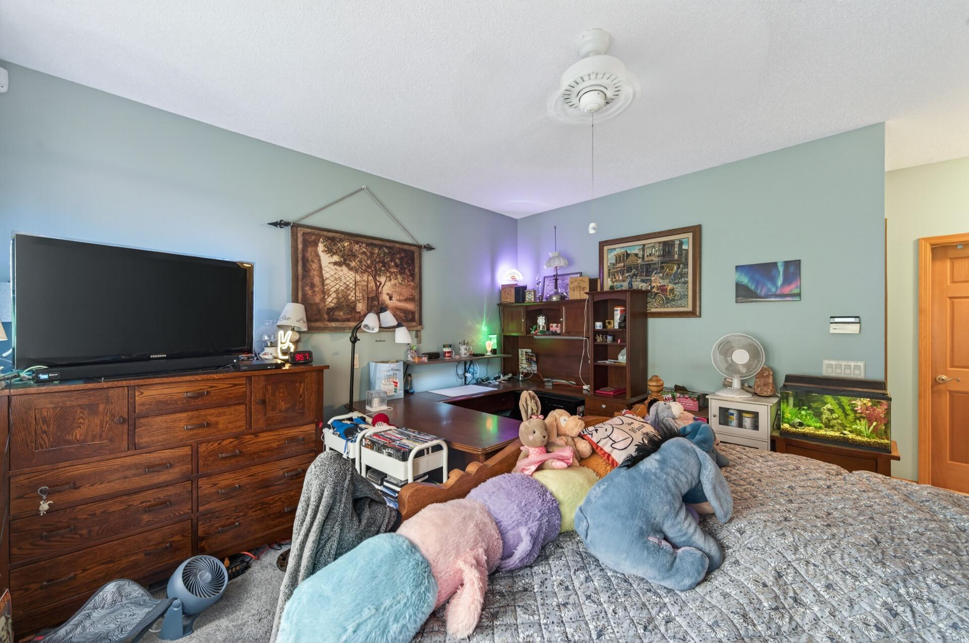 The primary bedroom also offers a large walk-in closet and private full ensuite.
