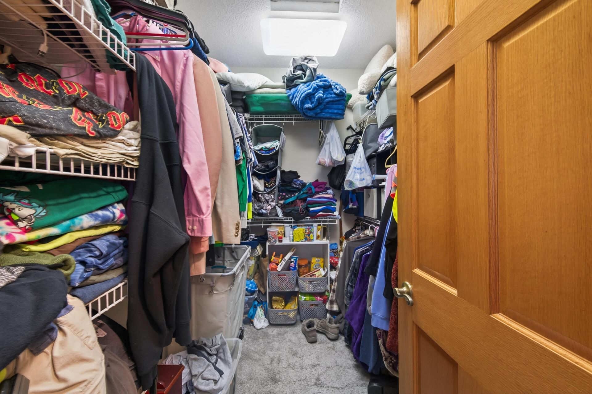 The walk-in closet keeps everything organized with storage for all your clothes and accessories.